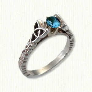 Tressa #1: 14kt white gold set with an oval blue gemstone